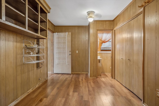 interior space featuring wooden walls and wood finished floors
