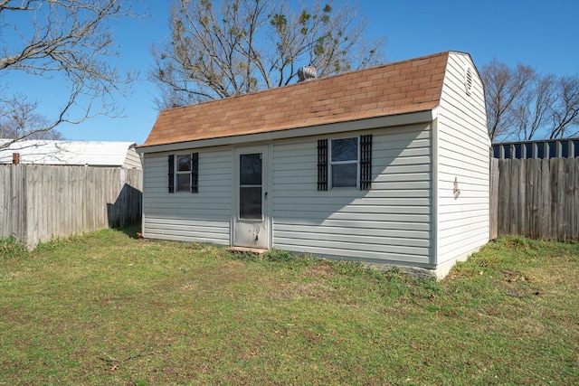 view of outbuilding with an outbuilding and a fenced backyard