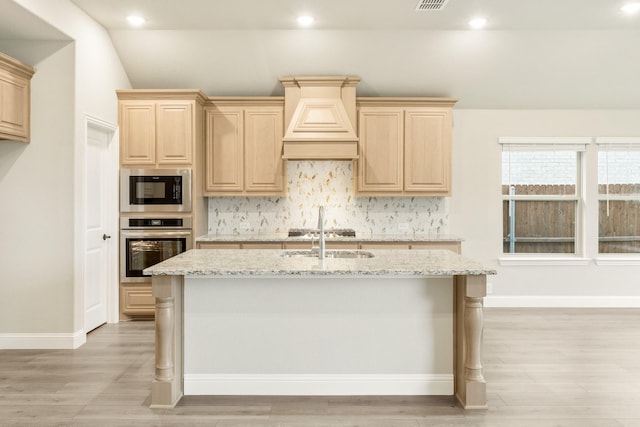 4400 Copper Point Dr, Fort Worth, TX 76036 - kitchen featuring appliances with stainless steel finishes, custom range hood, light brown cabinets, light stone countertops, and backsplash
