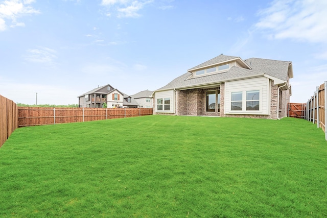 4400 Copper Point Dr, Fort Worth, TX 76036 - back of house with a fenced backyard, brick siding, and roof with shingles