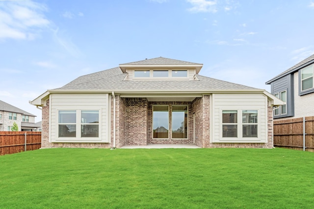 4400 Copper Point Dr, Fort Worth, TX 76036 - rear view of house featuring a fenced backyard, brick siding, and roof with shingles