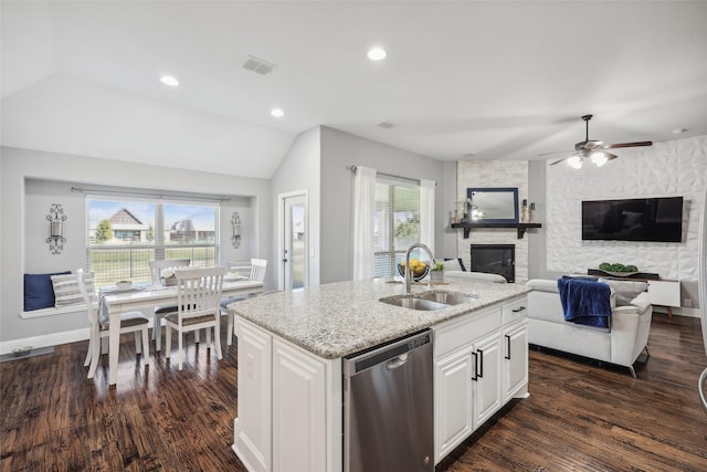9413 Lakeway Dr, Denton, TX 76226 - kitchen with dishwasher, a sink, a stone fireplace, dark wood-type flooring, and lofted ceiling