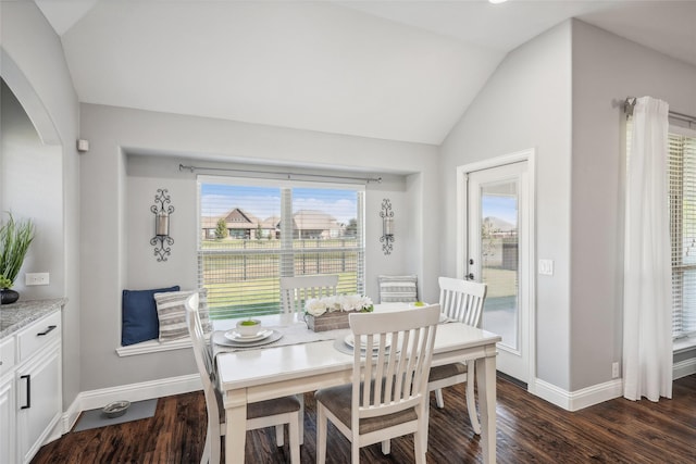 9413 Lakeway Dr, Denton, TX 76226 - dining room featuring vaulted ceiling, arched walkways, baseboards, and dark wood-style flooring