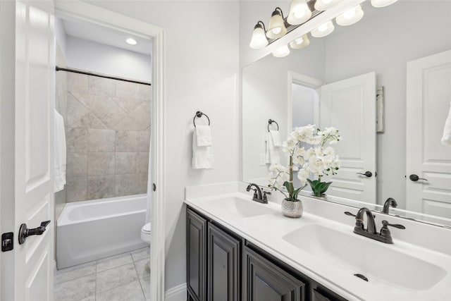 9413 Lakeway Dr, Denton, TX 76226 - full bathroom featuring double vanity, toilet, shower / washtub combination, and tile patterned floors