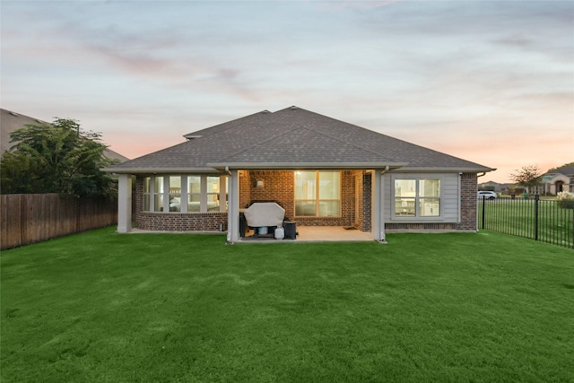 9413 Lakeway Dr, Denton, TX 76226 - rear view of house with a patio, brick siding, and roof with shingles