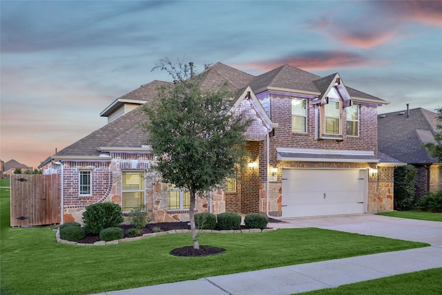 view of front of house with driveway, a shingled roof, stone siding, and a garage