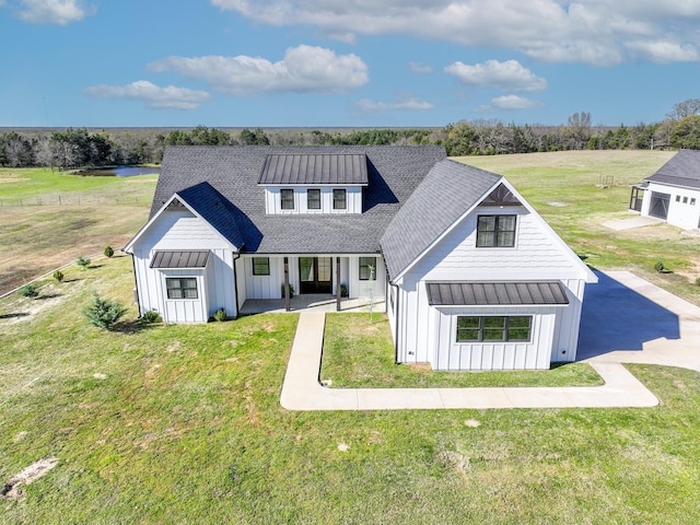 modern inspired farmhouse featuring a standing seam roof, board and batten siding, and metal roof