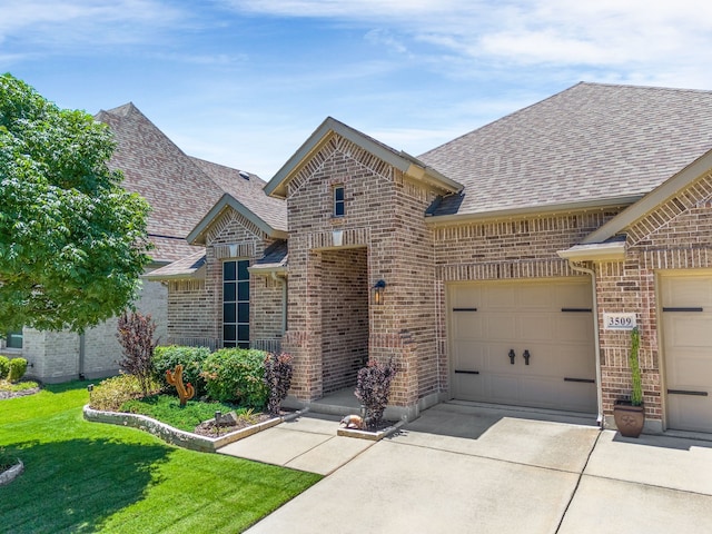 3509 Concord Dr, Melissa, TX 75454 - french country home featuring brick siding, a shingled roof, driveway, an attached garage, and a front lawn
