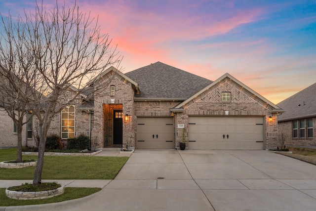3509 Concord Dr, Melissa, TX 75454 - french country style house featuring an attached garage, concrete driveway, brick siding, a yard, and a shingled roof