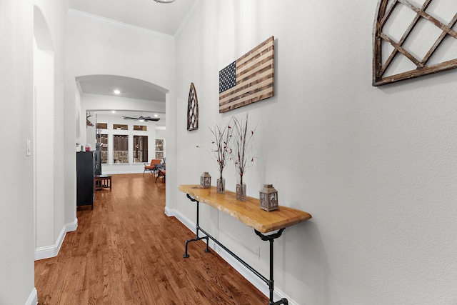3509 Concord Dr, Melissa, TX 75454 - hall with arched walkways, ornamental molding, wood finished floors, and baseboards