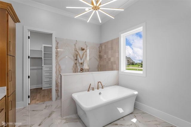 full bath with vanity, baseboards, a freestanding bath, marble finish floor, and a shower