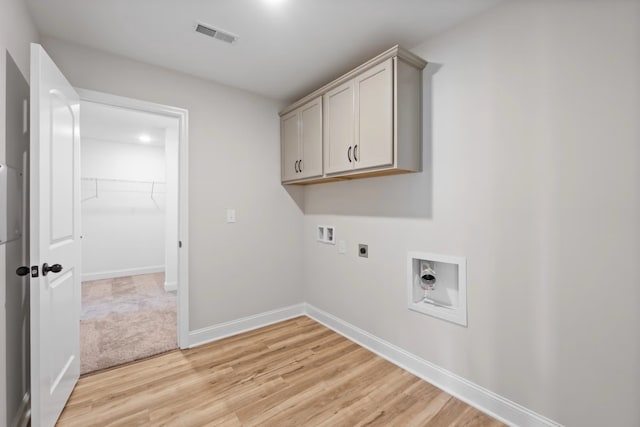 214 Briarwood Dr, Nevada, TX 75173 - clothes washing area with electric dryer hookup, visible vents, washer hookup, light wood-style floors, and baseboards