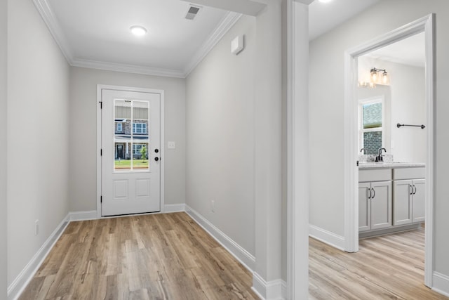214 Briarwood Dr, Nevada, TX 75173 - entryway featuring visible vents, crown molding, and light wood finished floors