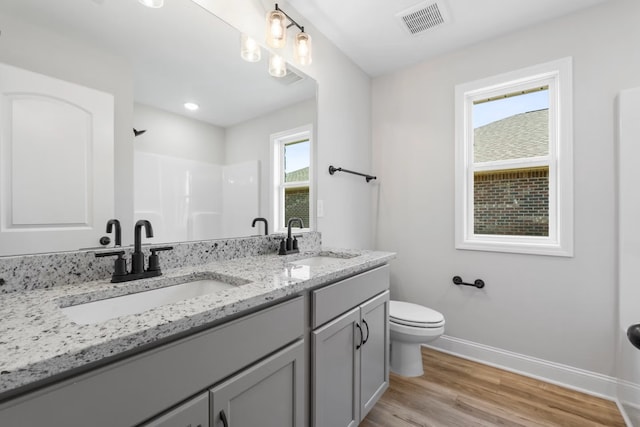 214 Briarwood Dr, Nevada, TX 75173 - bathroom with a sink, visible vents, baseboards, and walk in shower