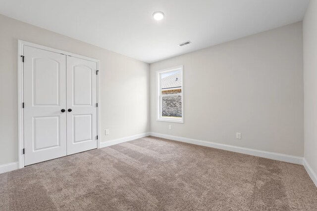 214 Briarwood Dr, Nevada, TX 75173 - unfurnished bedroom with visible vents, baseboards, carpet, and a closet