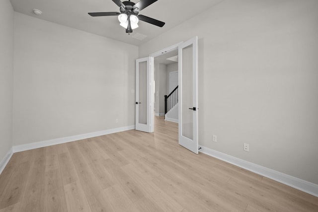2012 Tolleson Dr, Fort Worth, TX 76008 - unfurnished room with light wood finished floors, ceiling fan, french doors, and a smoke detector