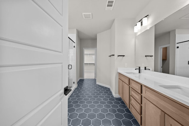 2012 Tolleson Dr, Fort Worth, TX 76008 - full bathroom with double vanity, a stall shower, tile patterned floors, and a spacious closet
