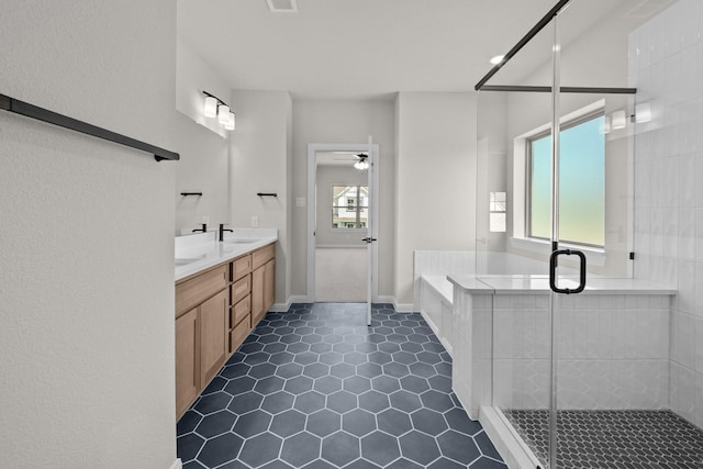 2012 Tolleson Dr, Fort Worth, TX 76008 - full bath featuring double vanity, a bath, a stall shower, tile patterned floors, and a ceiling fan