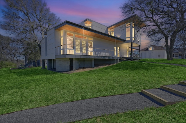 view of side of property with a lawn