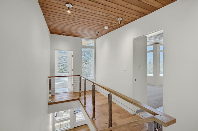 staircase with wood ceiling