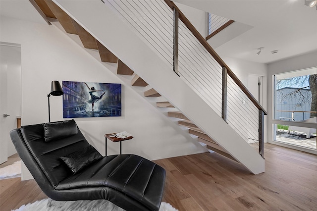 staircase featuring wood finished floors
