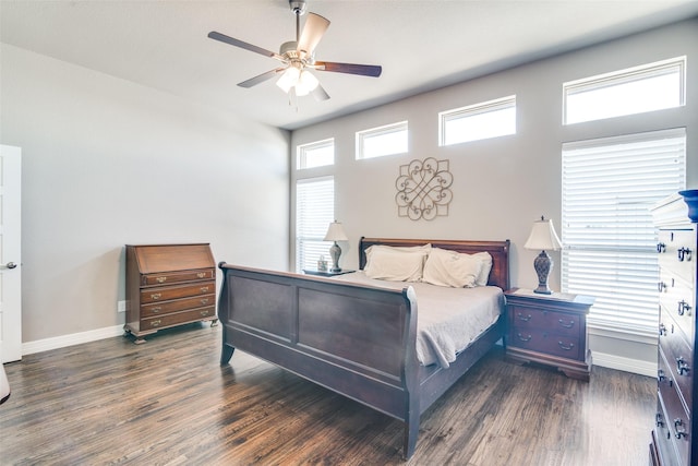 6565 Oak Point Cir, Royse City, TX 75189 - bedroom with dark wood finished floors, baseboards, and ceiling fan