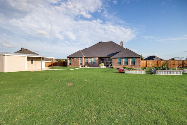 6565 Oak Point Cir, Royse City, TX 75189 - rear view of property featuring brick siding and a chimney