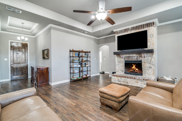 6565 Oak Point Cir, Royse City, TX 75189 - living area with a raised ceiling, arched walkways, wood finished floors, baseboards, and crown molding