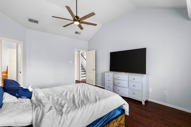 bedroom with dark wood finished floors, visible vents, baseboards, and lofted ceiling