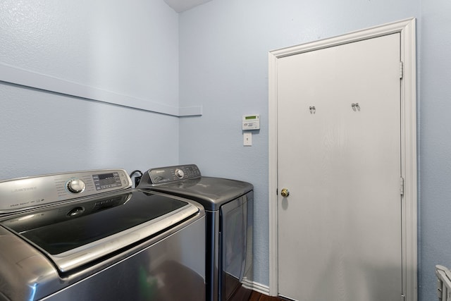 washroom featuring laundry area and independent washer and dryer