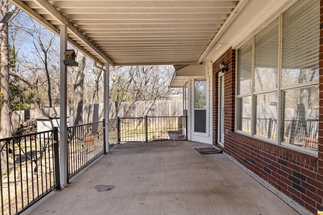 view of patio / terrace featuring fence