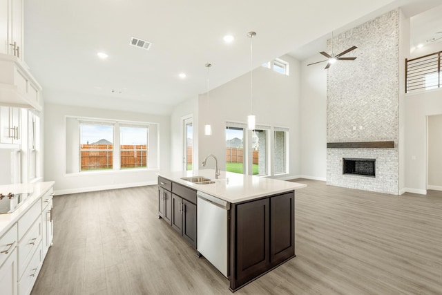 817 Lakewood Ct, Midlothian, TX 76065 - kitchen with a sink, open floor plan, dishwashing machine, a high ceiling, and healthy amount of natural light
