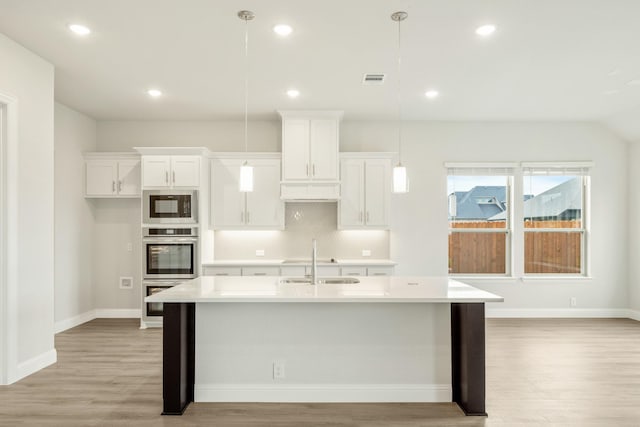 817 Lakewood Ct, Midlothian, TX 76065 - kitchen featuring a sink, built in microwave, white cabinetry, light wood finished floors, and recessed lighting