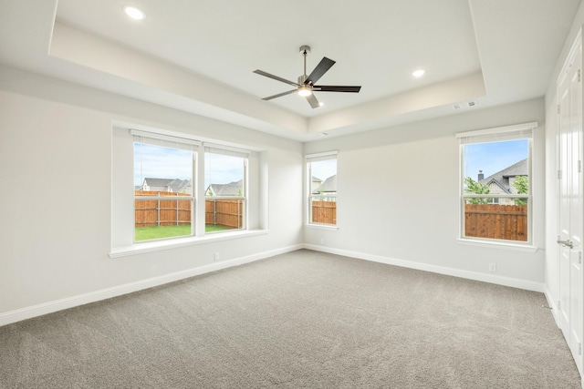 817 Lakewood Ct, Midlothian, TX 76065 - spare room featuring a raised ceiling, carpet floors, a ceiling fan, healthy amount of natural light, and recessed lighting