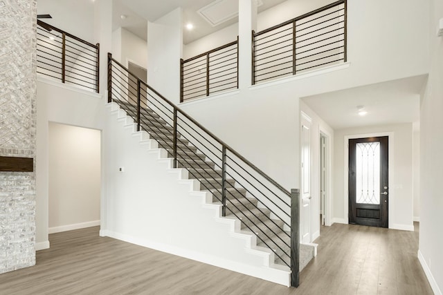 817 Lakewood Ct, Midlothian, TX 76065 - entryway with a towering ceiling, wood finished floors, stairs, and baseboards