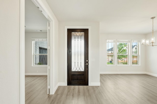 817 Lakewood Ct, Midlothian, TX 76065 - foyer entrance featuring wood finished floors, a chandelier, and baseboards