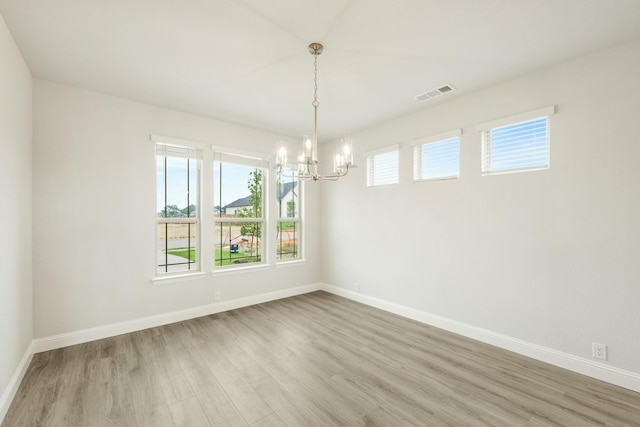 817 Lakewood Ct, Midlothian, TX 76065 - unfurnished room featuring a chandelier, wood finished floors, and baseboards