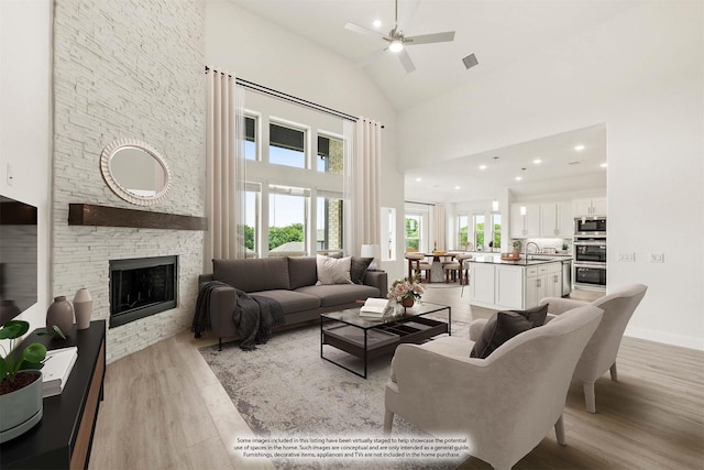 4217 Bel Air Dr, Midlothian, TX 76065 - living room with light wood-style flooring, high vaulted ceiling, a fireplace, ceiling fan, and baseboards