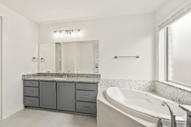 4217 Bel Air Dr, Midlothian, TX 76065 - bathroom with vanity, a bath, and tile patterned floors