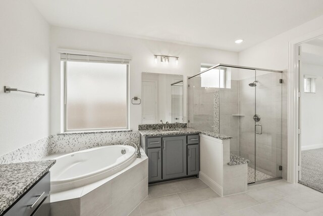 4217 Bel Air Dr, Midlothian, TX 76065 - bathroom featuring vanity, a shower stall, a bath, and tile patterned flooring