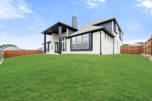4217 Bel Air Dr, Midlothian, TX 76065 - back of house with a chimney, a shingled roof, and brick siding