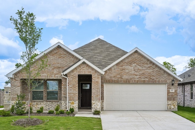381 Sierra Rdg, Lavon, TX 75166 - view of front of property featuring driveway, a garage, a front yard, and stone siding