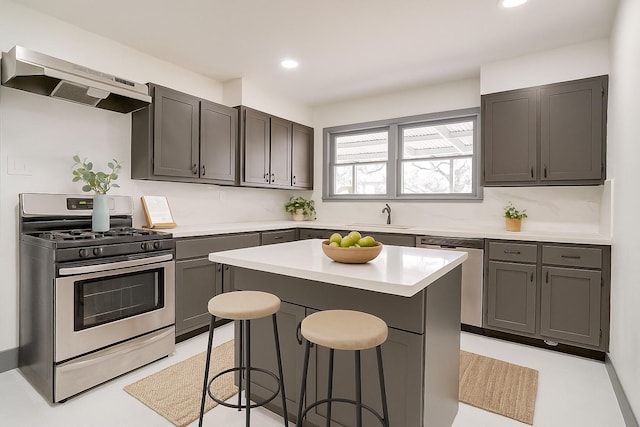1036 Springer Ave, Fort Worth, TX 76114 - kitchen featuring appliances with stainless steel finishes, custom exhaust hood, a sink, a breakfast bar area, and light countertops