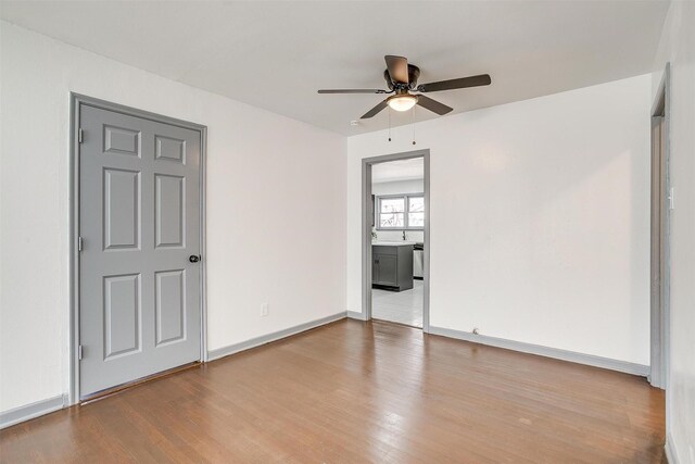 1036 Springer Ave, Fort Worth, TX 76114 - unfurnished room featuring wood finished floors, a ceiling fan, and baseboards