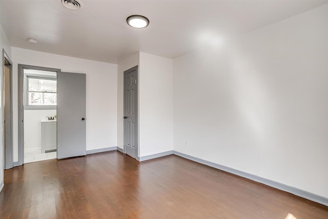 1036 Springer Ave, Fort Worth, TX 76114 - spare room with dark wood-style flooring, baseboards, and a smoke detector