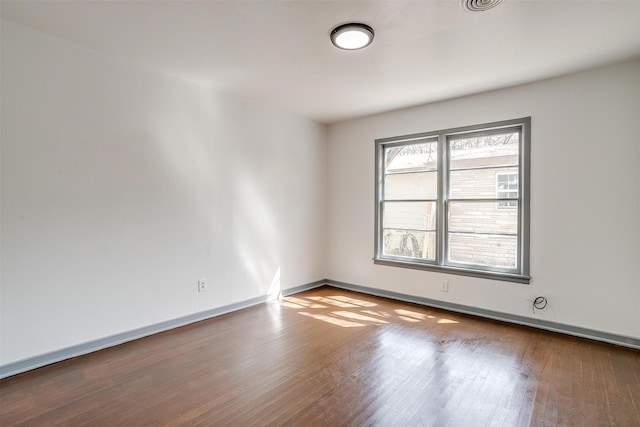 1036 Springer Ave, Fort Worth, TX 76114 - spare room featuring wood finished floors and baseboards