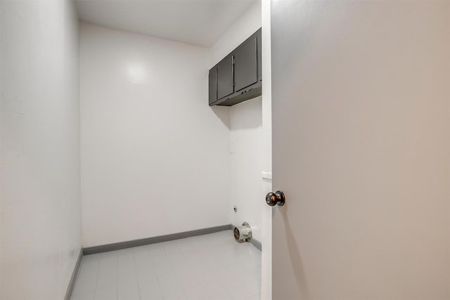 1036 Springer Ave, Fort Worth, TX 76114 - laundry room featuring cabinet space and baseboards