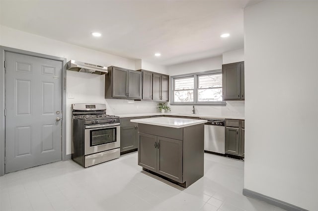 1036 Springer Ave, Fort Worth, TX 76114 - kitchen featuring stainless steel appliances, range hood, light countertops, a sink, and a center island