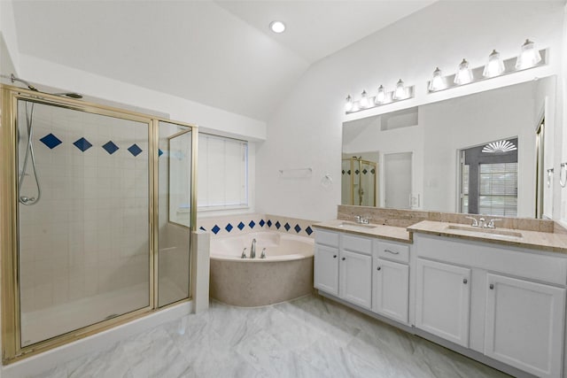 bathroom featuring vaulted ceiling, a garden tub, a shower stall, double vanity, and marble finish flooring
