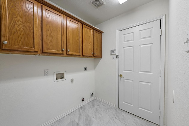 clothes washing area with cabinet space, gas dryer hookup, electric dryer hookup, washer hookup, and light marble finish floors